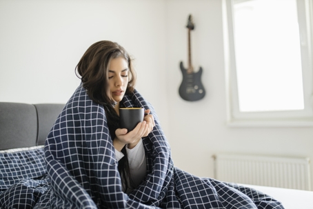woman feeling cold at home